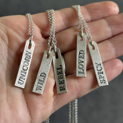 UNMUTED word tag necklace